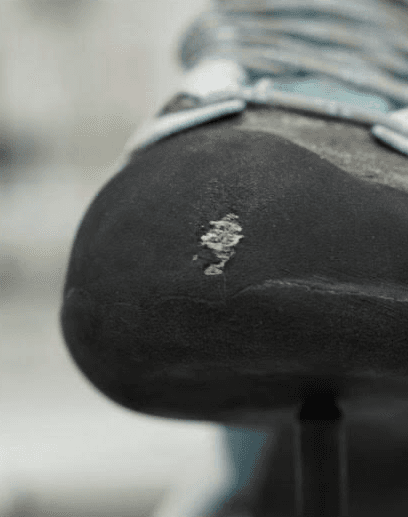 Climbing shoe toe worn through the rand, needing a rand repair